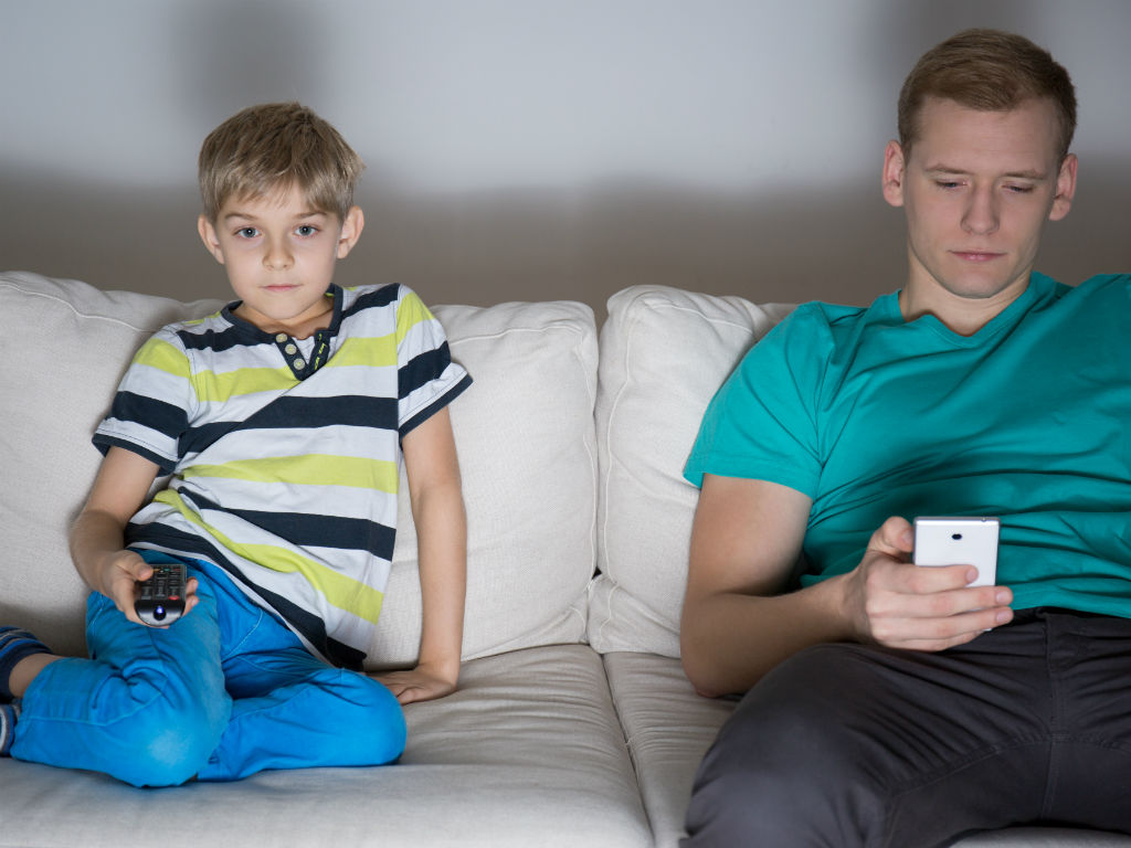 http://www.shutterstock.com/pic-243712897/stock-photo-dad-and-son-addicted-to-modern-technology.html