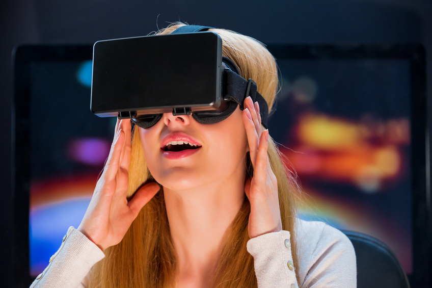 Girl with pleasure uses head-mounted display